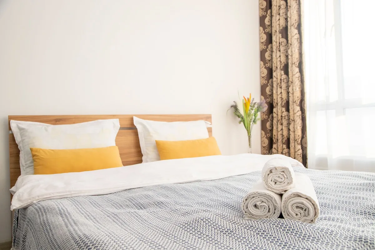 modern hotel room with floral headboard and dedicated workspace