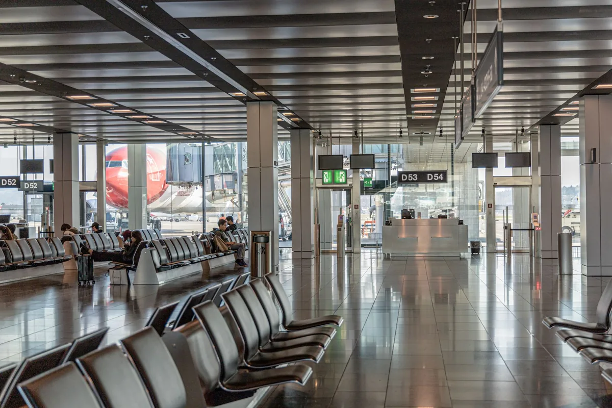 airport departures terminal passengers boarding gate