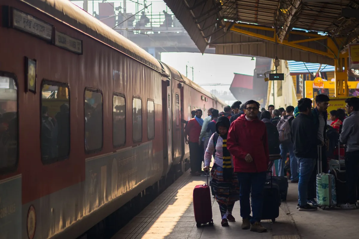 crowded domestic train station in India with families traveling