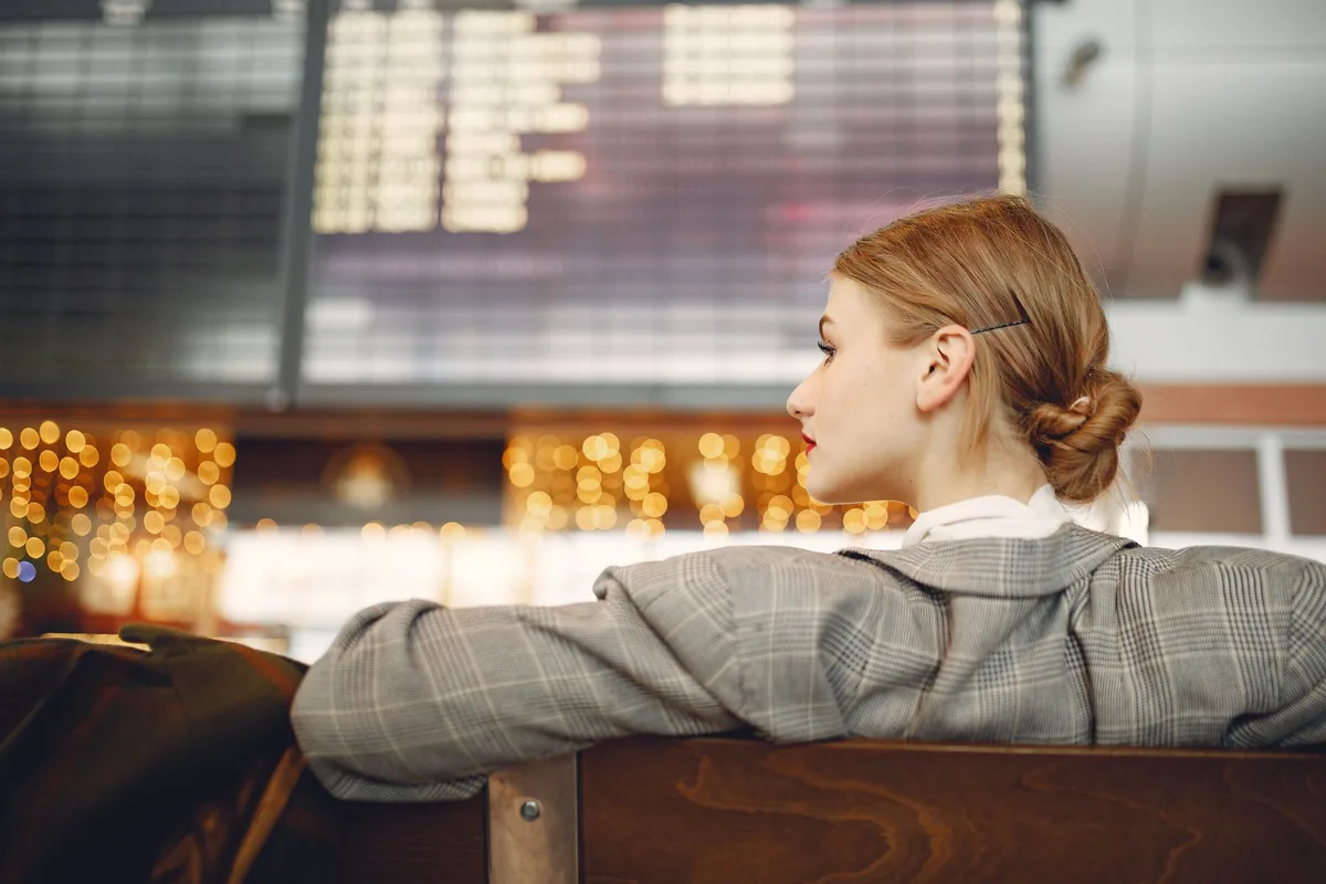 athlete resting in airport departure lounge