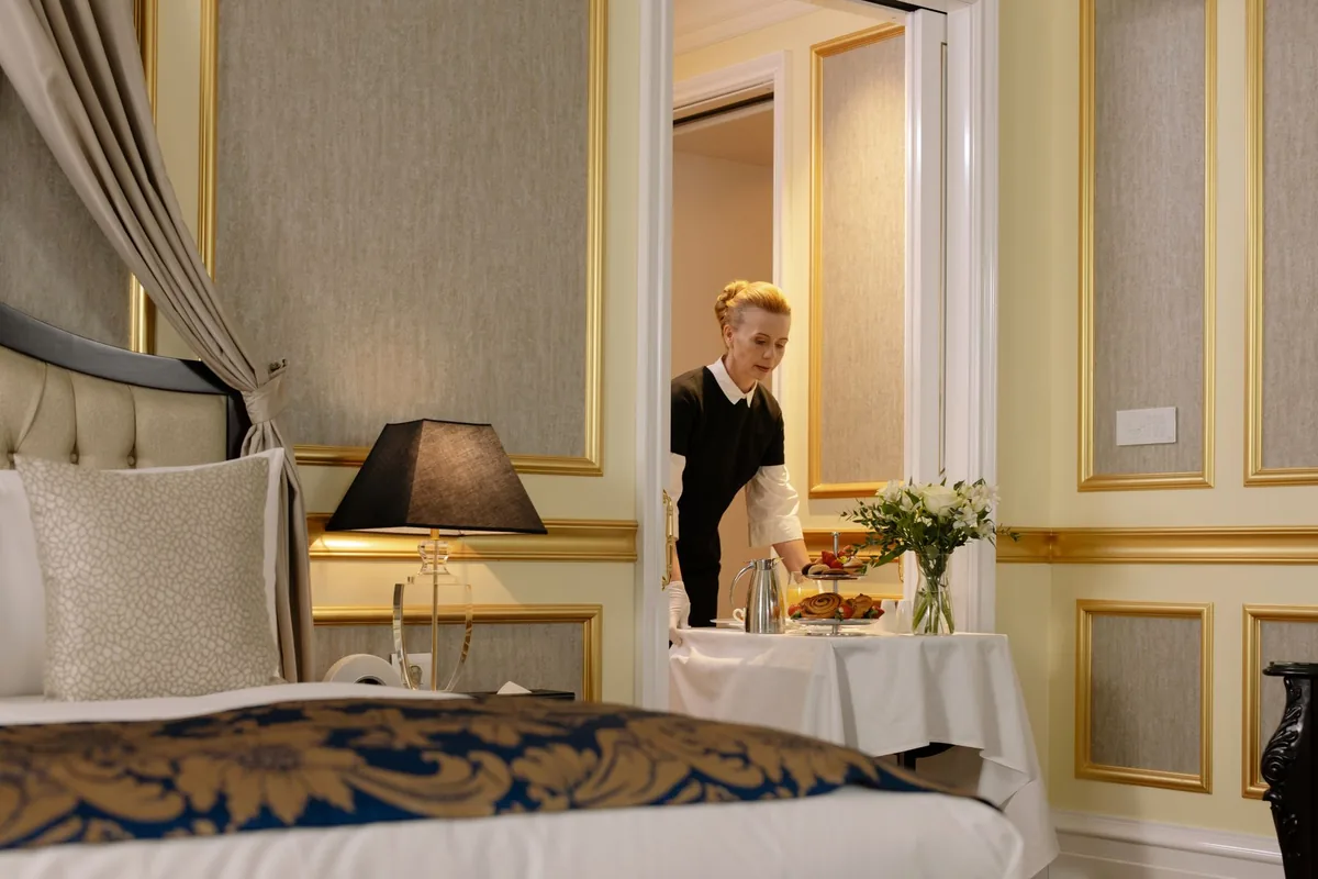 smartphone ordering room service bed