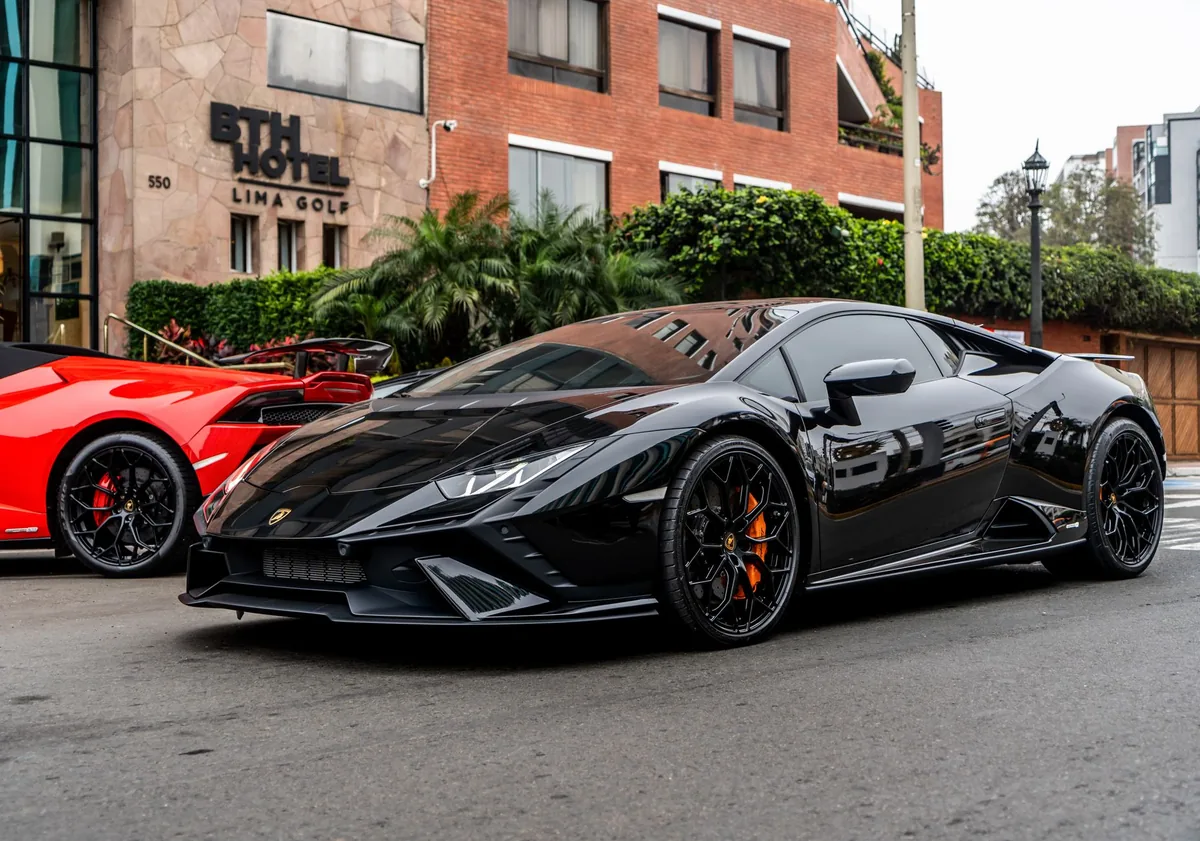 luxury sports car parked outside hotel
