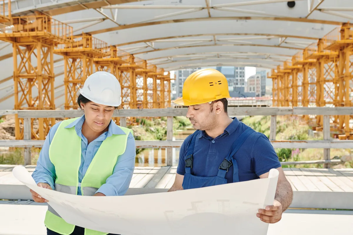 construction worker architectural blueprints