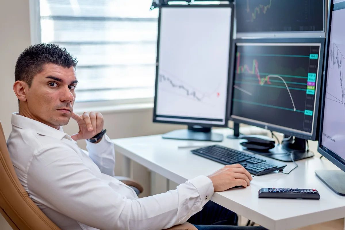 commercial revenue analyst working on dual desktop monitors