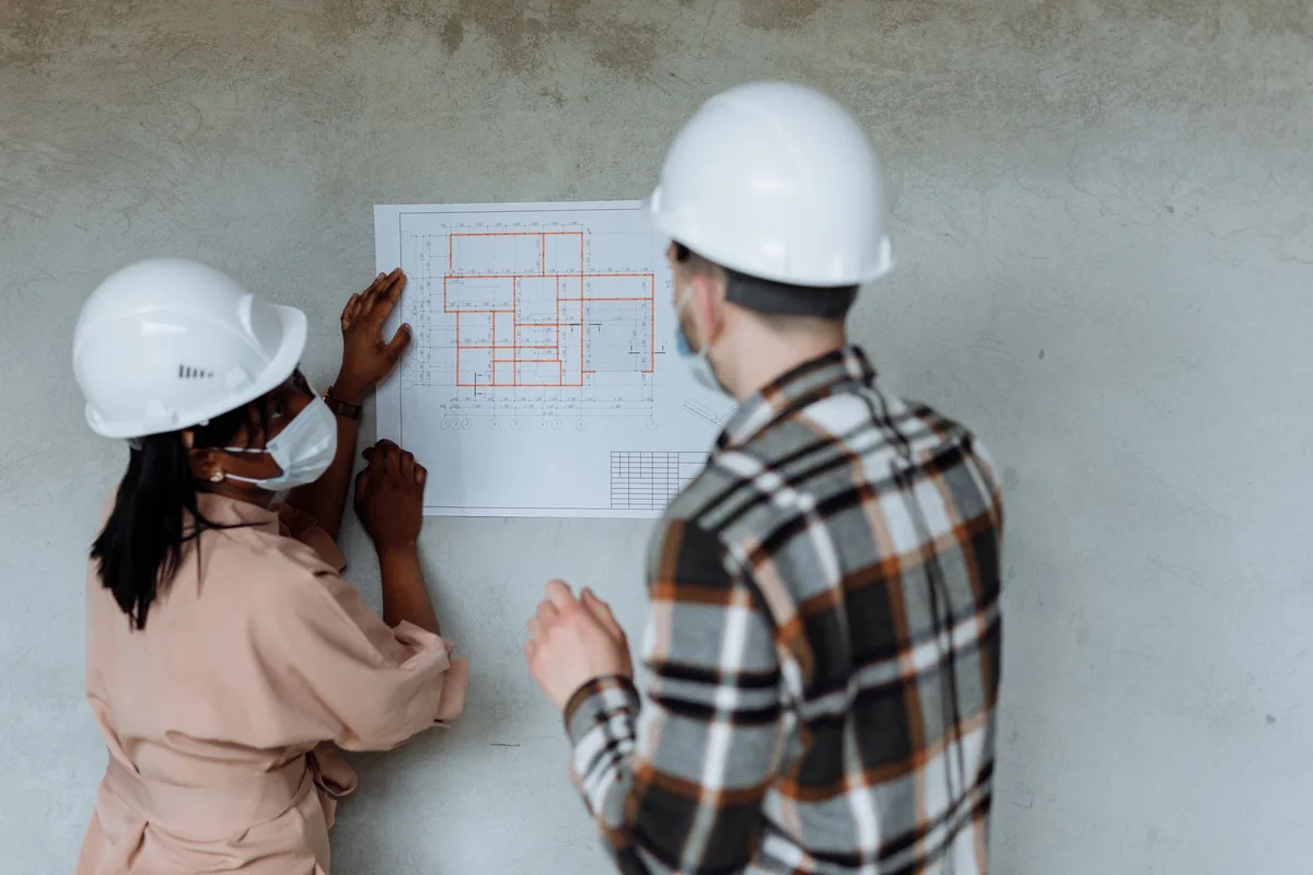 architects reviewing blueprint plans