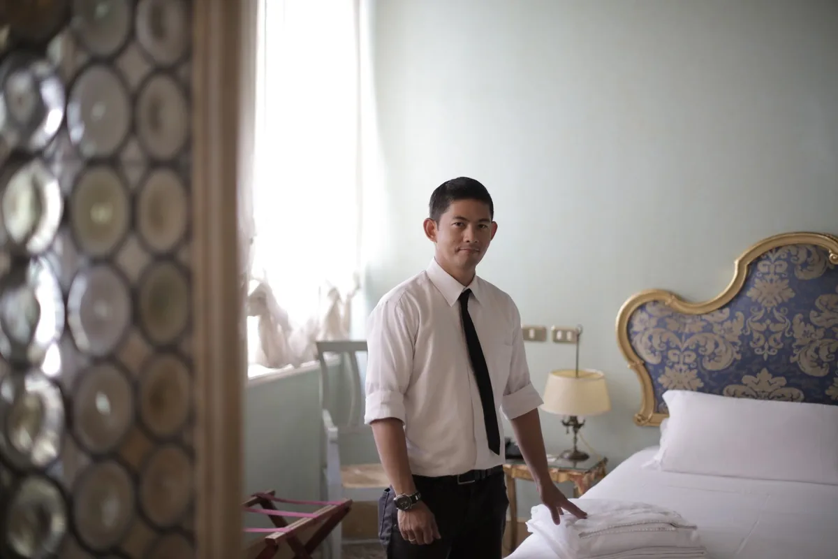 hotel guest wearing royal drapes vintage portrait setting