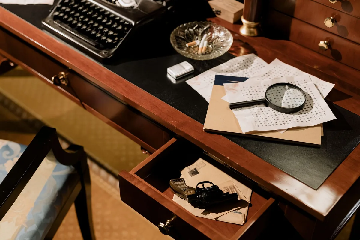 detective desk magnifier papers