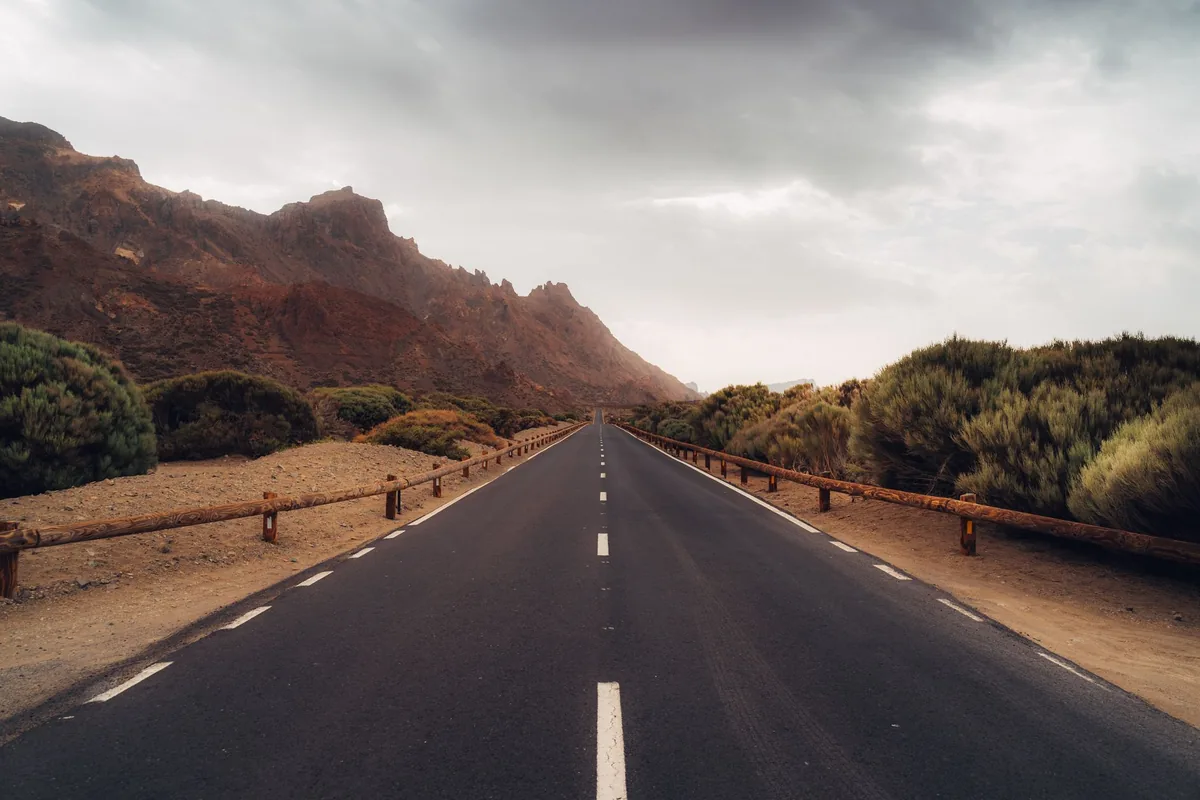highway road leading toward mountains