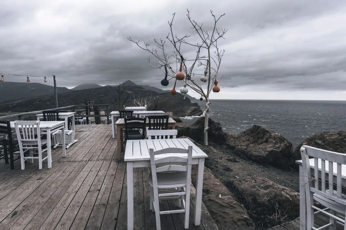 stone terrace outdoor dining table seaside