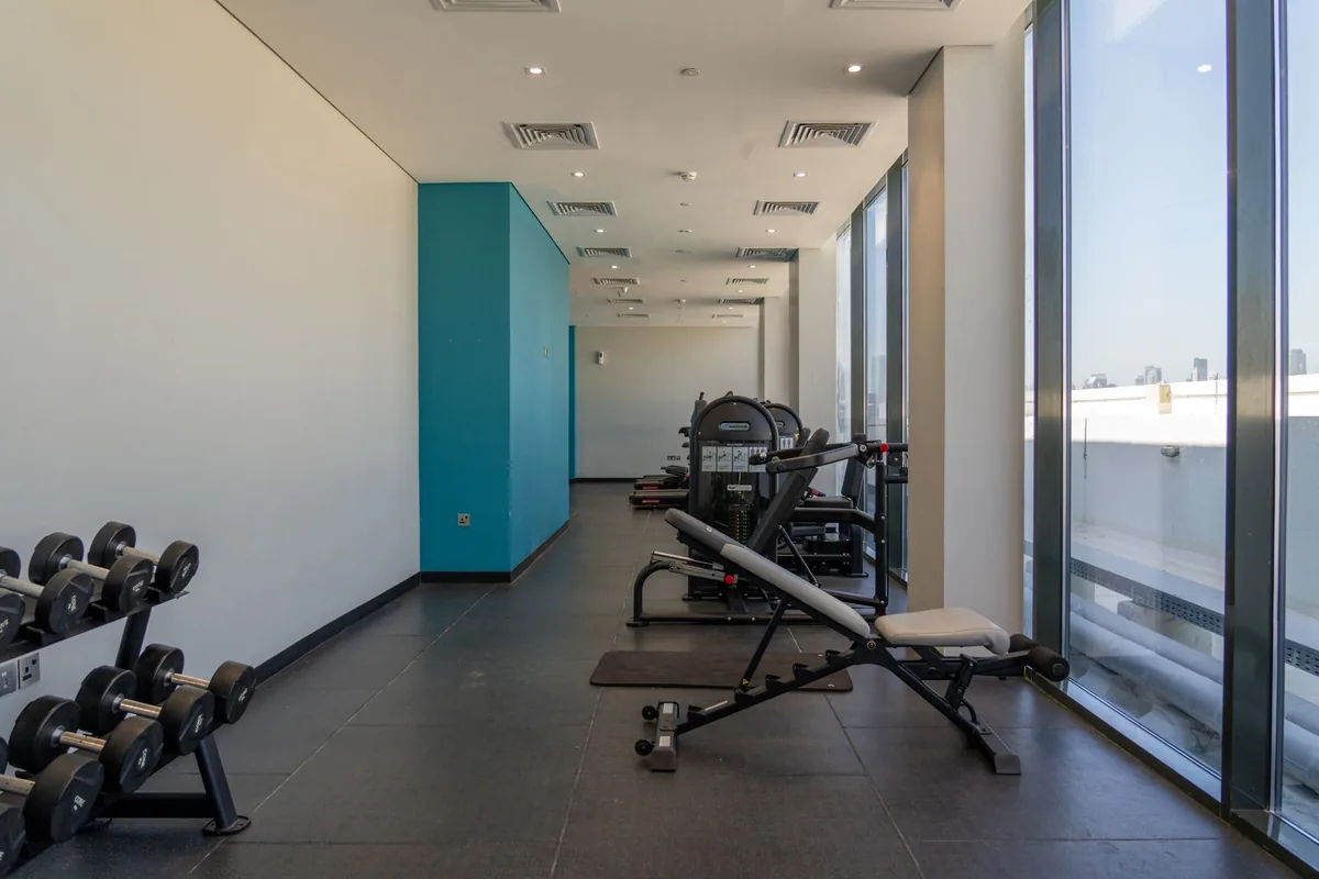 commercial hotel fitness center dumbbells treadmill