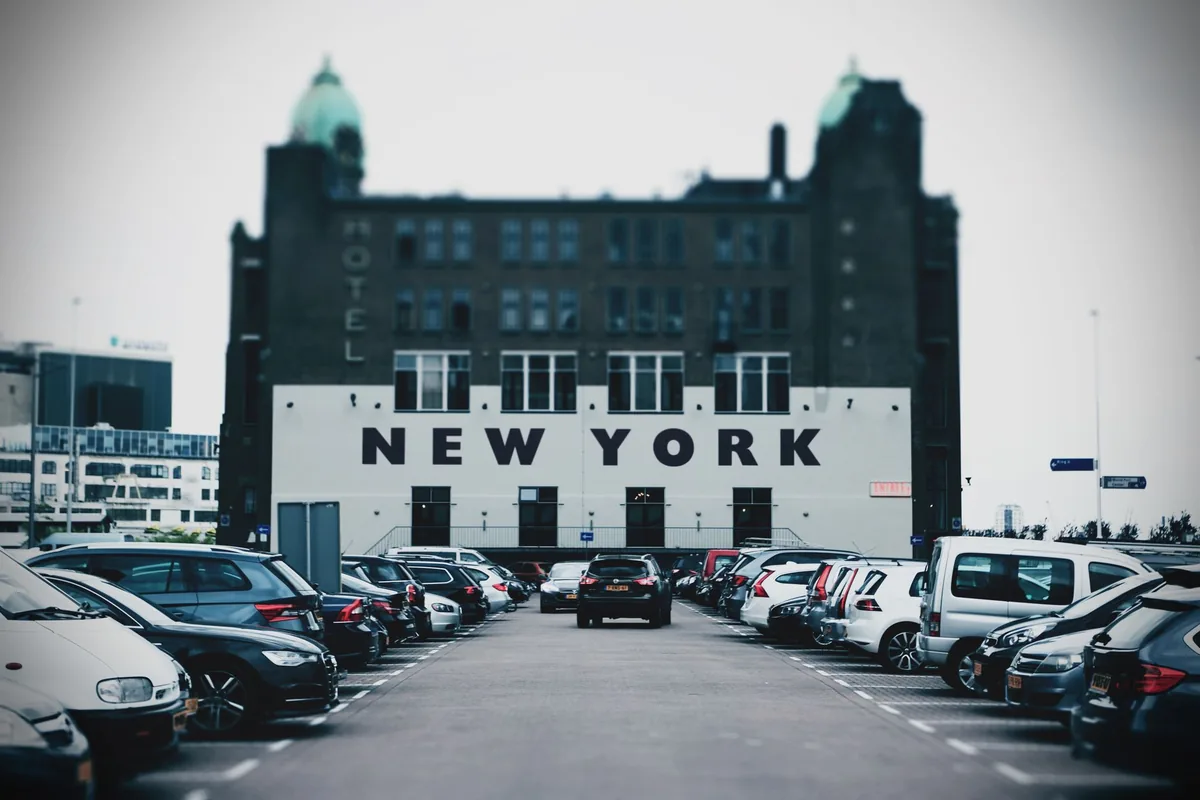 hotel exterior signage with parking lot