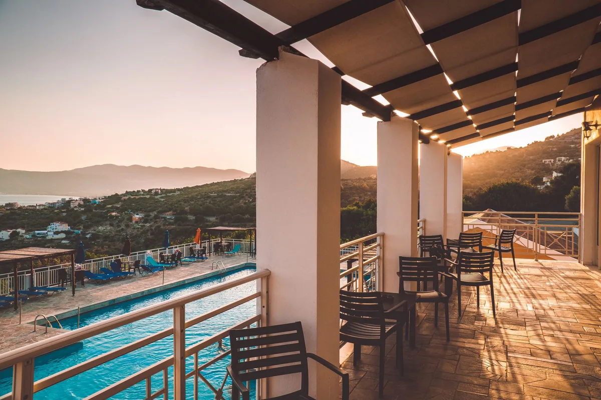 luxury hotel terrace pool surrounded by olive trees