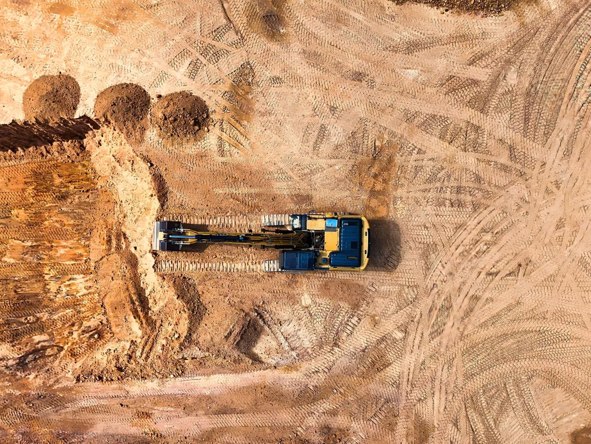 construction site with heavy machinery performing earthwork