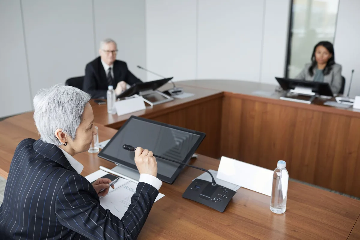 business executive speaking in boardroom meeting