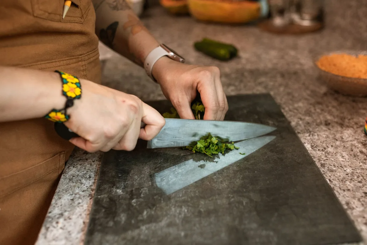 chef preparing plant based food commercial kitchen