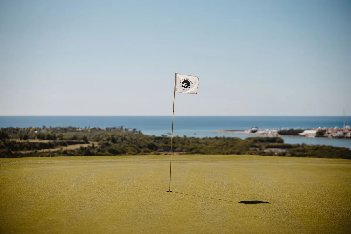 golf course green flag ocean view