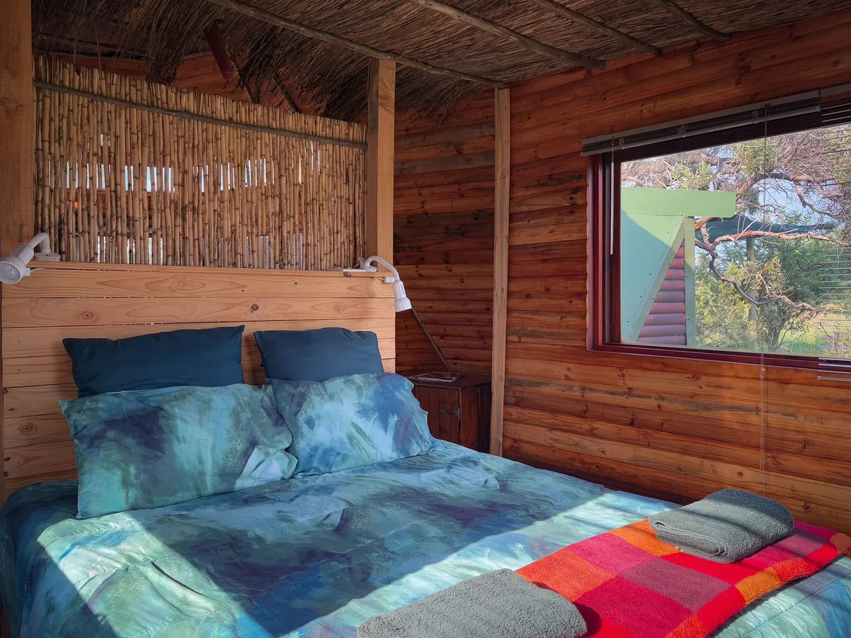 timber studio cabin interior bed kitchenette