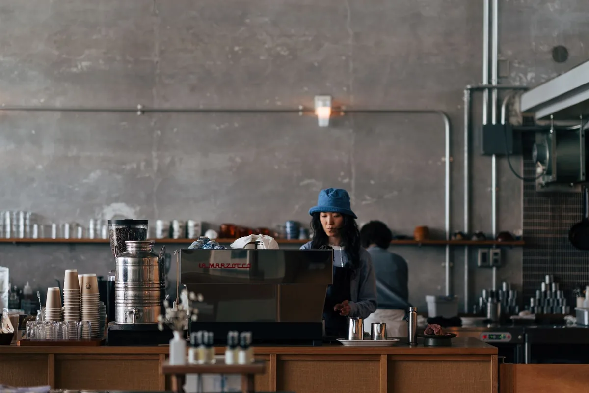 cafe interior with french patina blue millwork and coffee counter