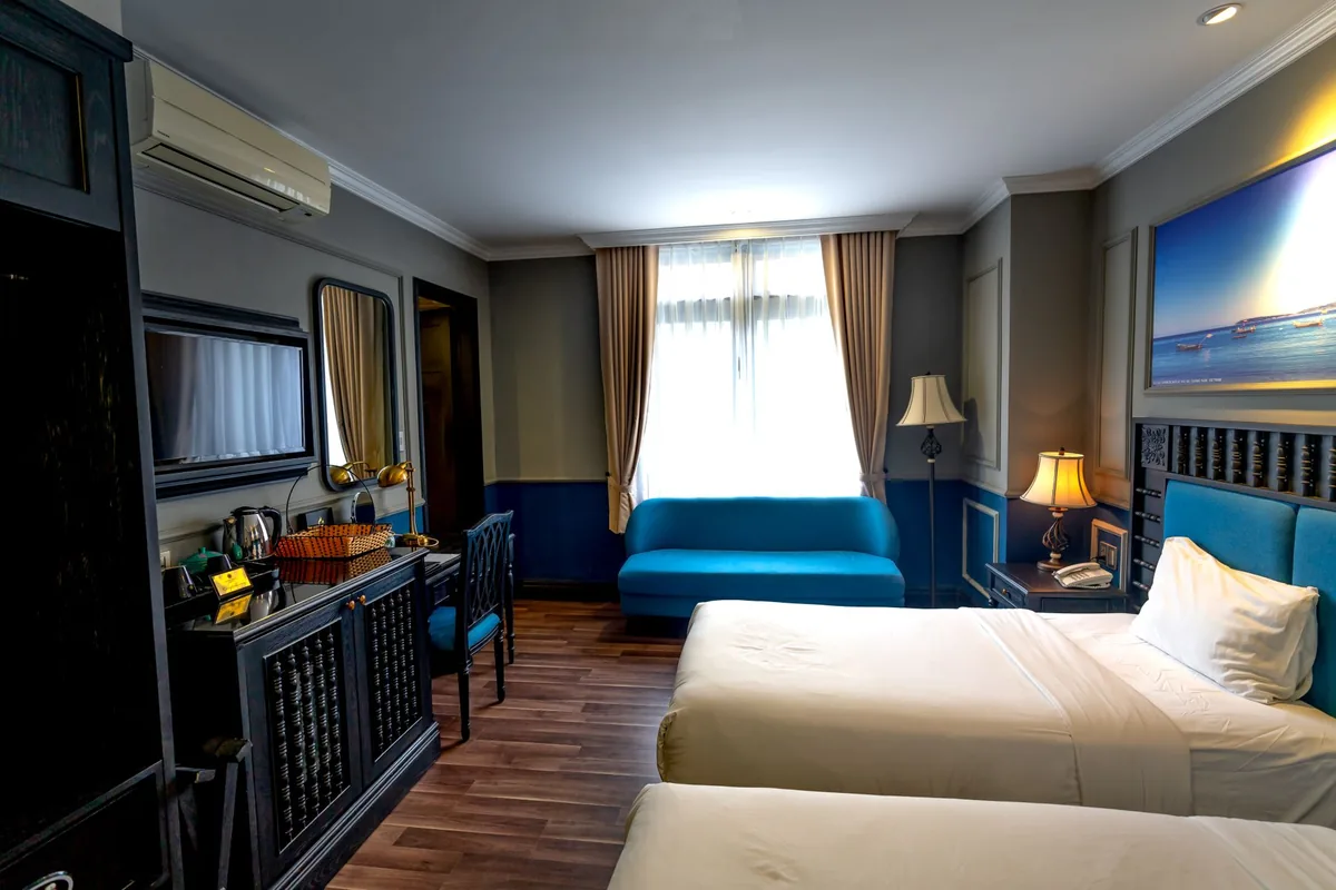 hotel double king room interior with a sofa bed