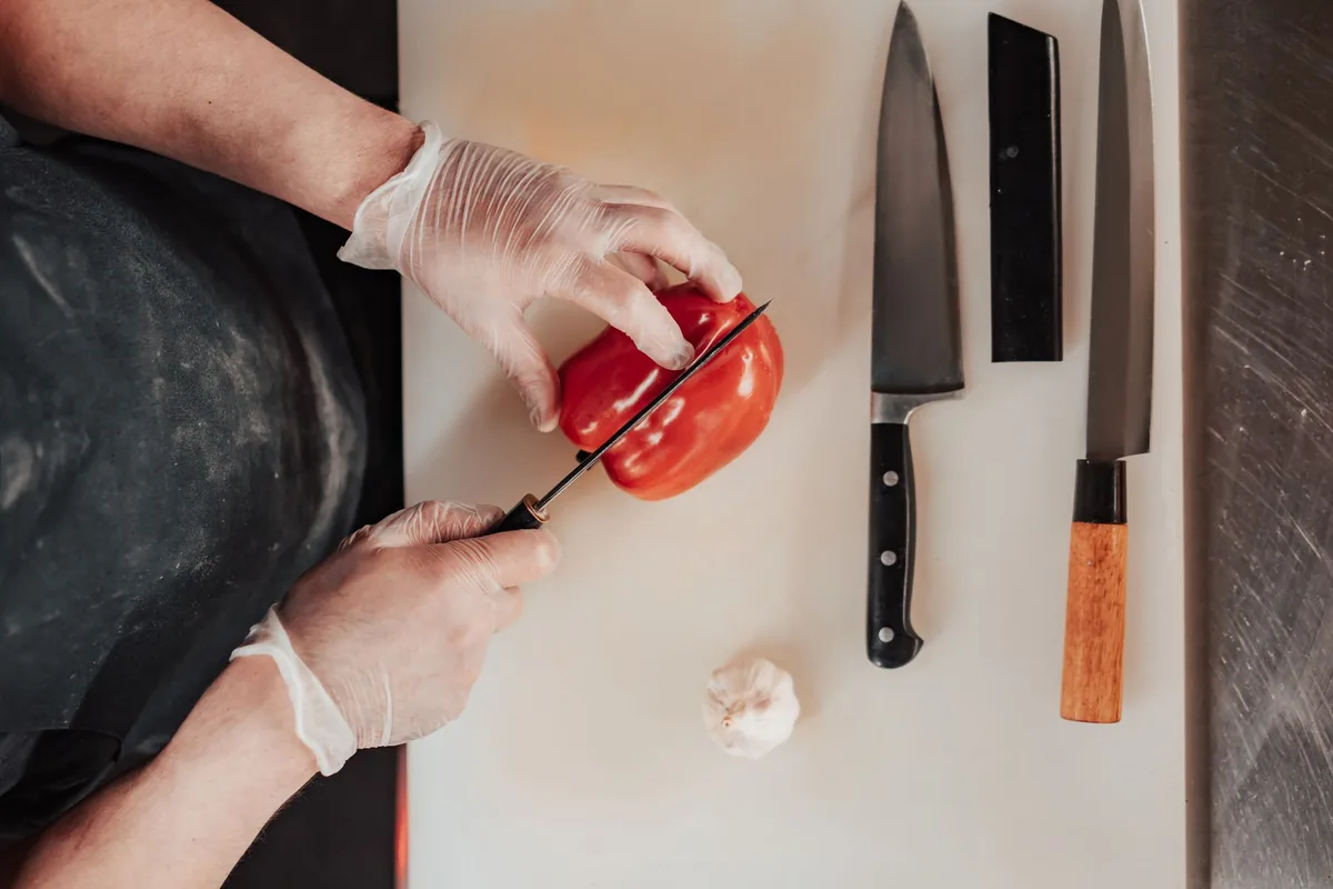 professional chef preparing food with stainless steel knife