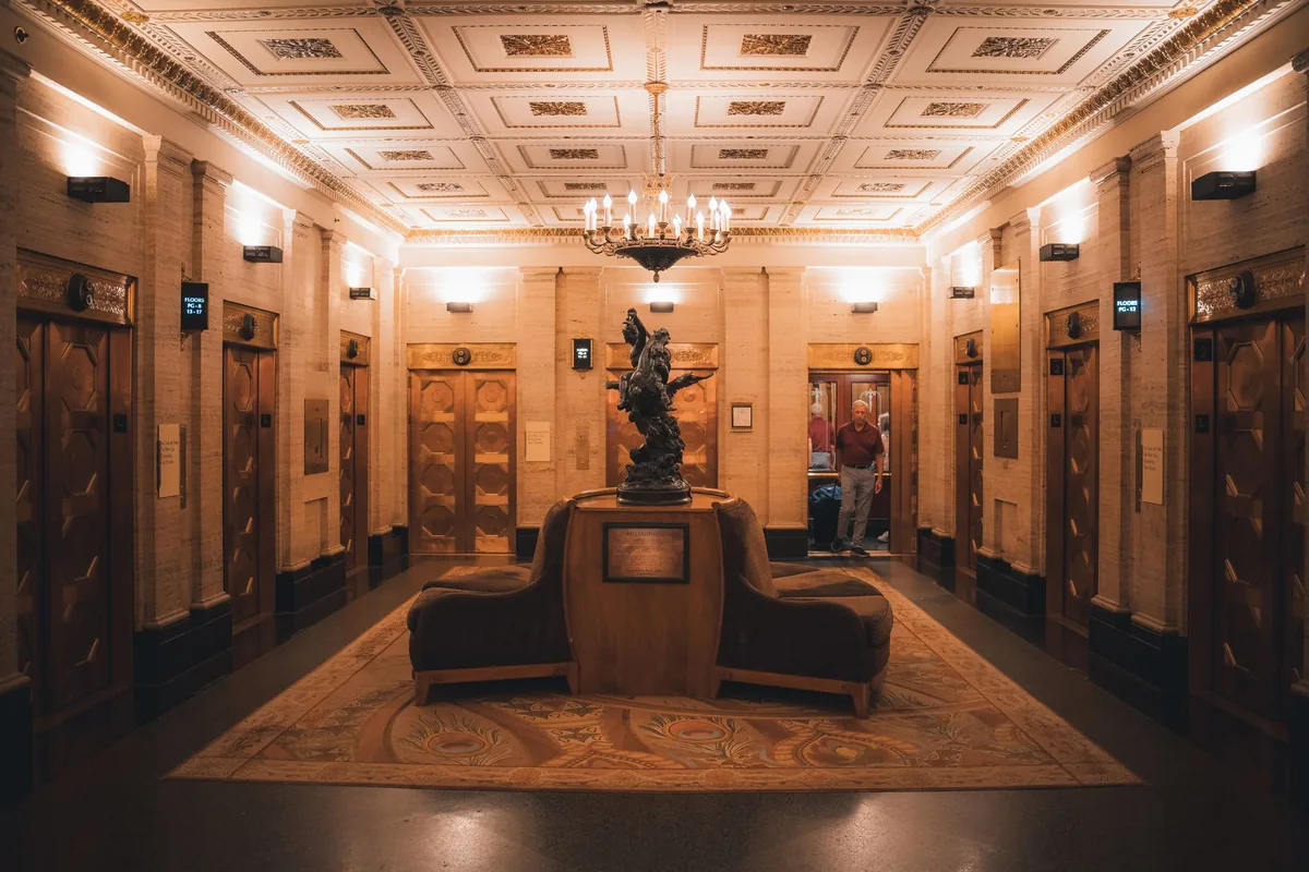 hotel lobby with historic artifacts and art on display