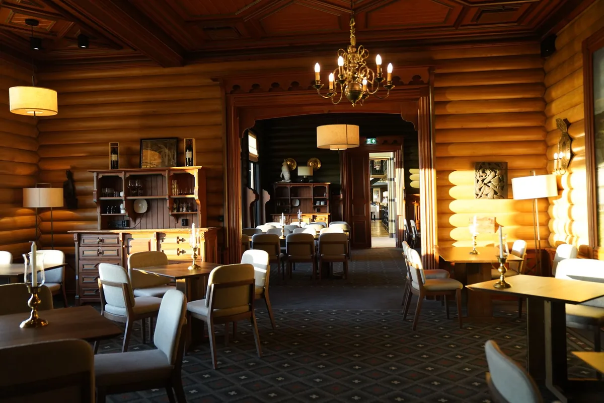 hotel restaurant dining room with multiple tables