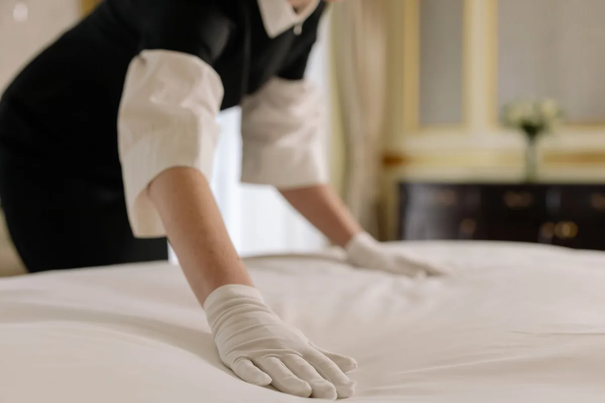 hotel housekeeping inspects room smartphone