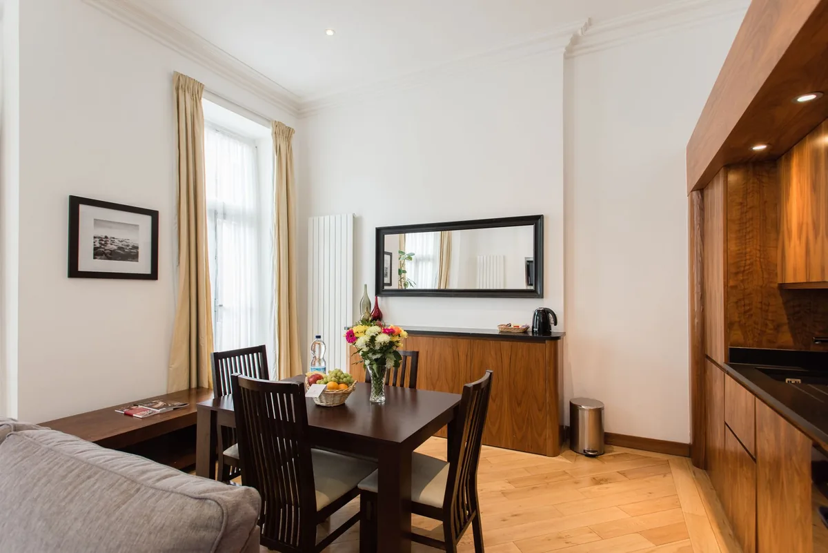hotel apartment suite living area with kitchenette