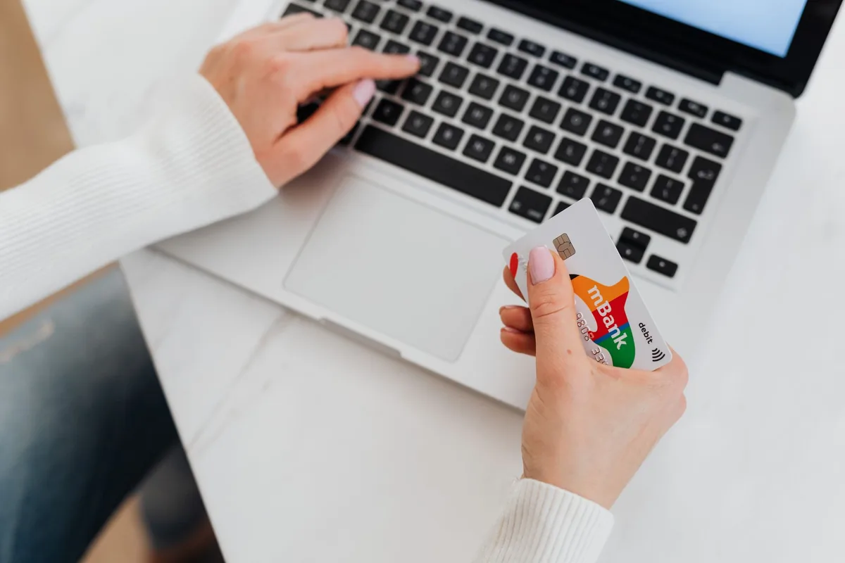 credit card resting on a laptop keyboard