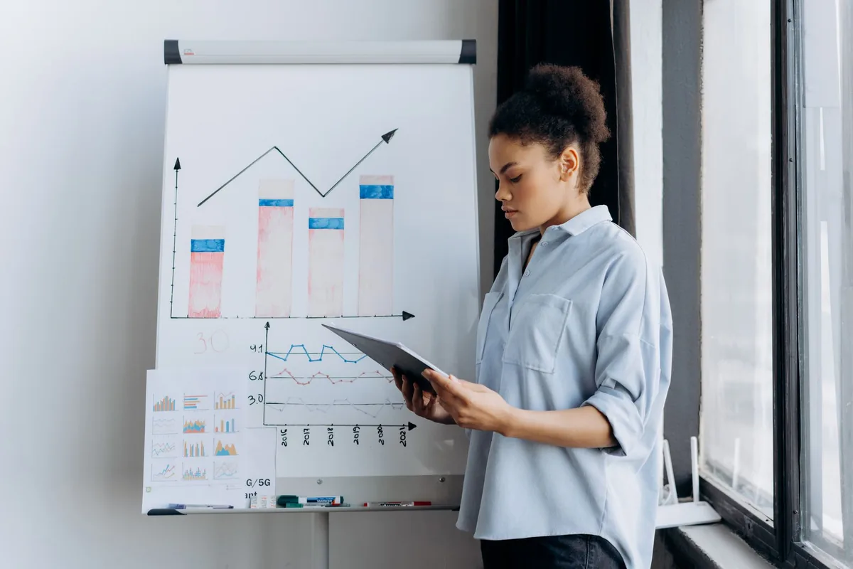 hotel executive analyzing revenue charts tablet