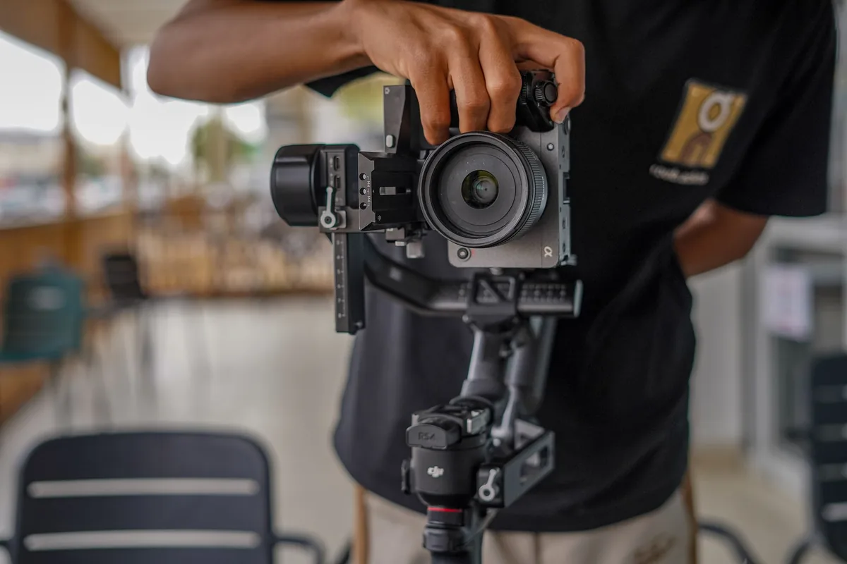 professional photographer filming video in luxury hotel restaurant