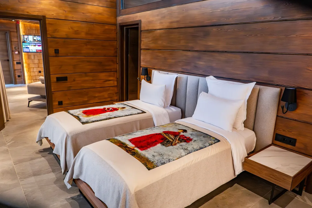 hotel guestroom interior with modern bed and suite layout