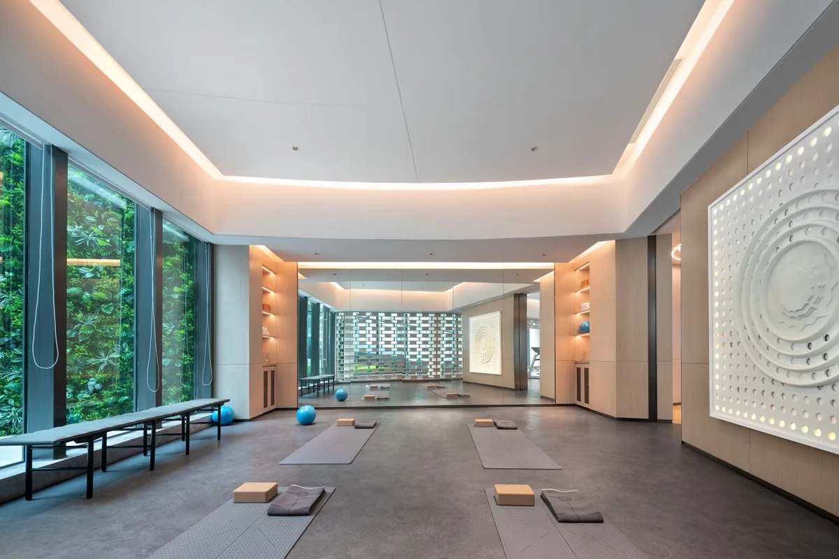 modern hotel fitness and yoga center with exercise equipment