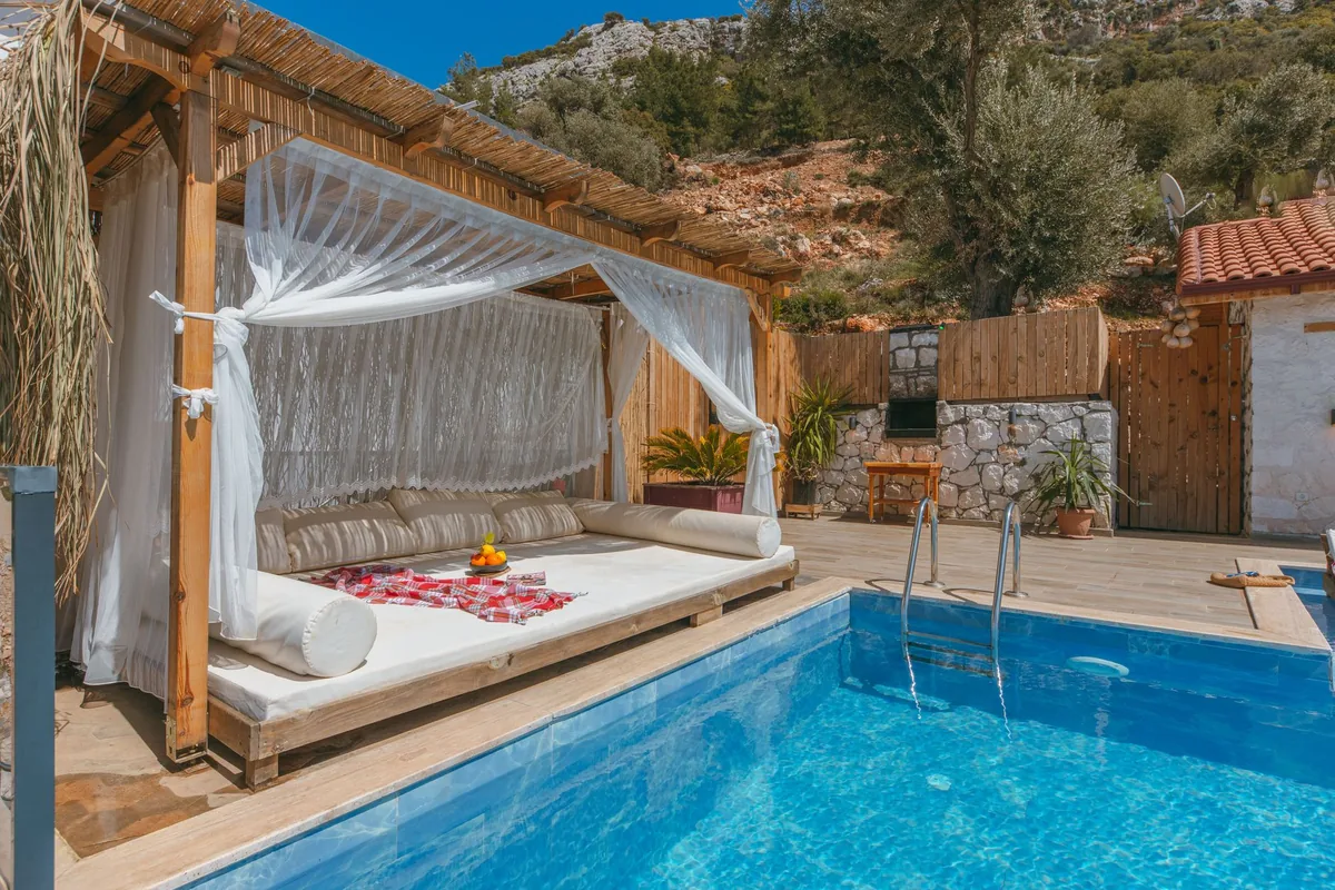 outdoor resort pool area with private cabanas