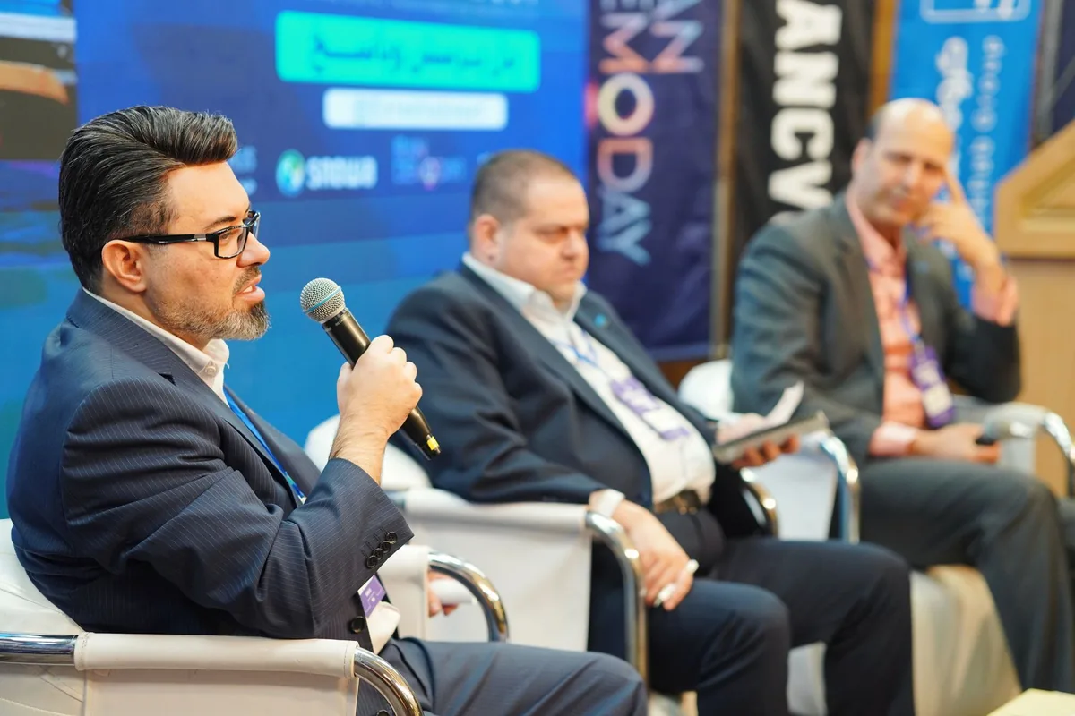 airline executive speaking stage microphone corporate event