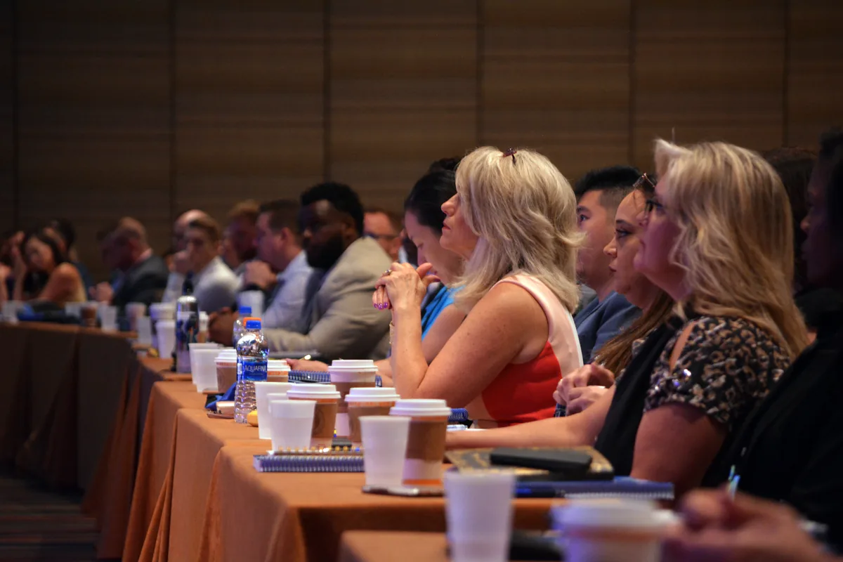 corporate executives seated audience conference