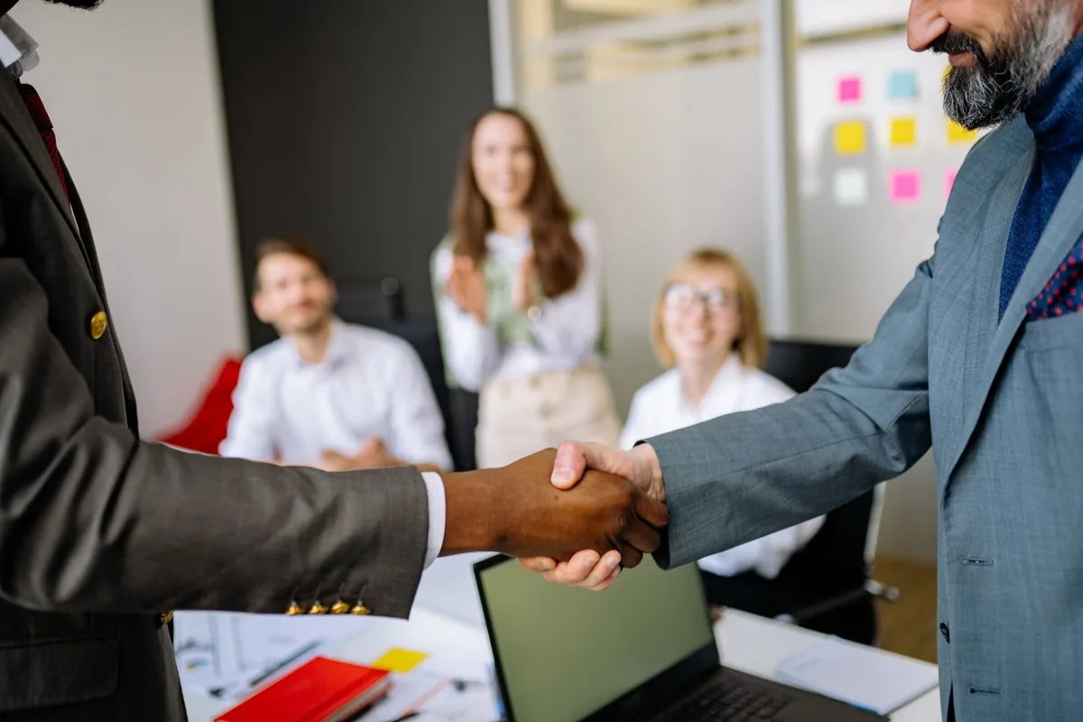 corporate office handshake meeting
