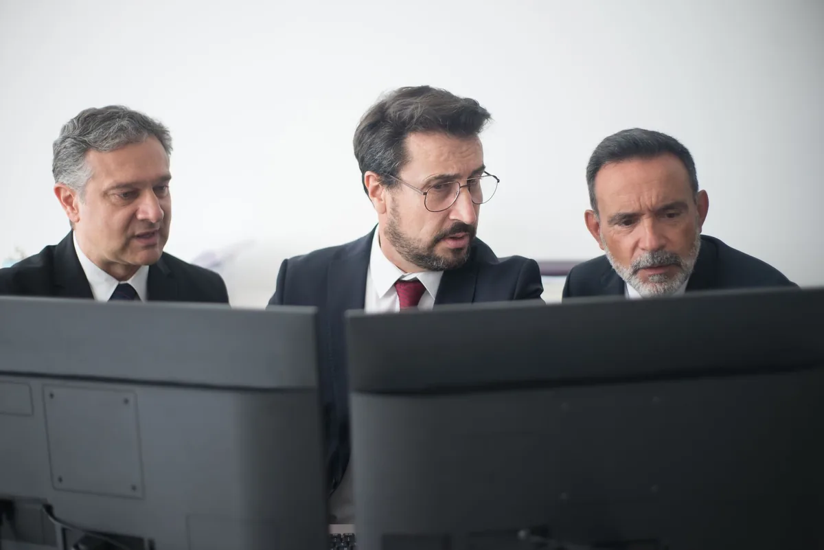 hotel management team looking at dashboard screen