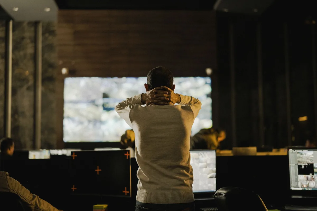 hotel management staff reviewing data on a screen