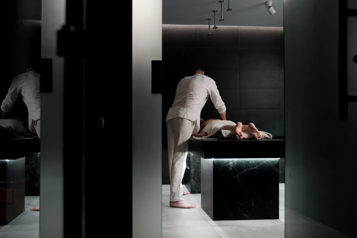 hotel spa treatment room with massage table