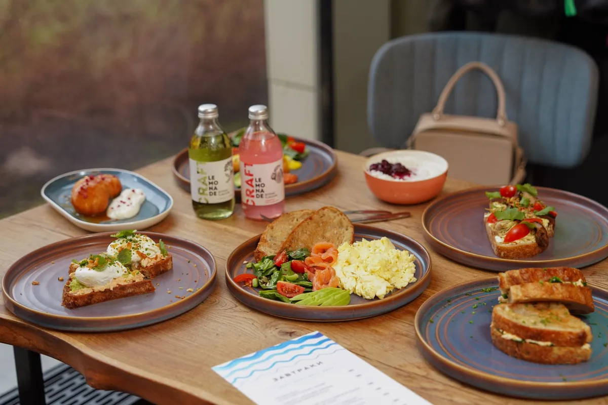 contemporary café with wooden tables and Australian breakfast dishes