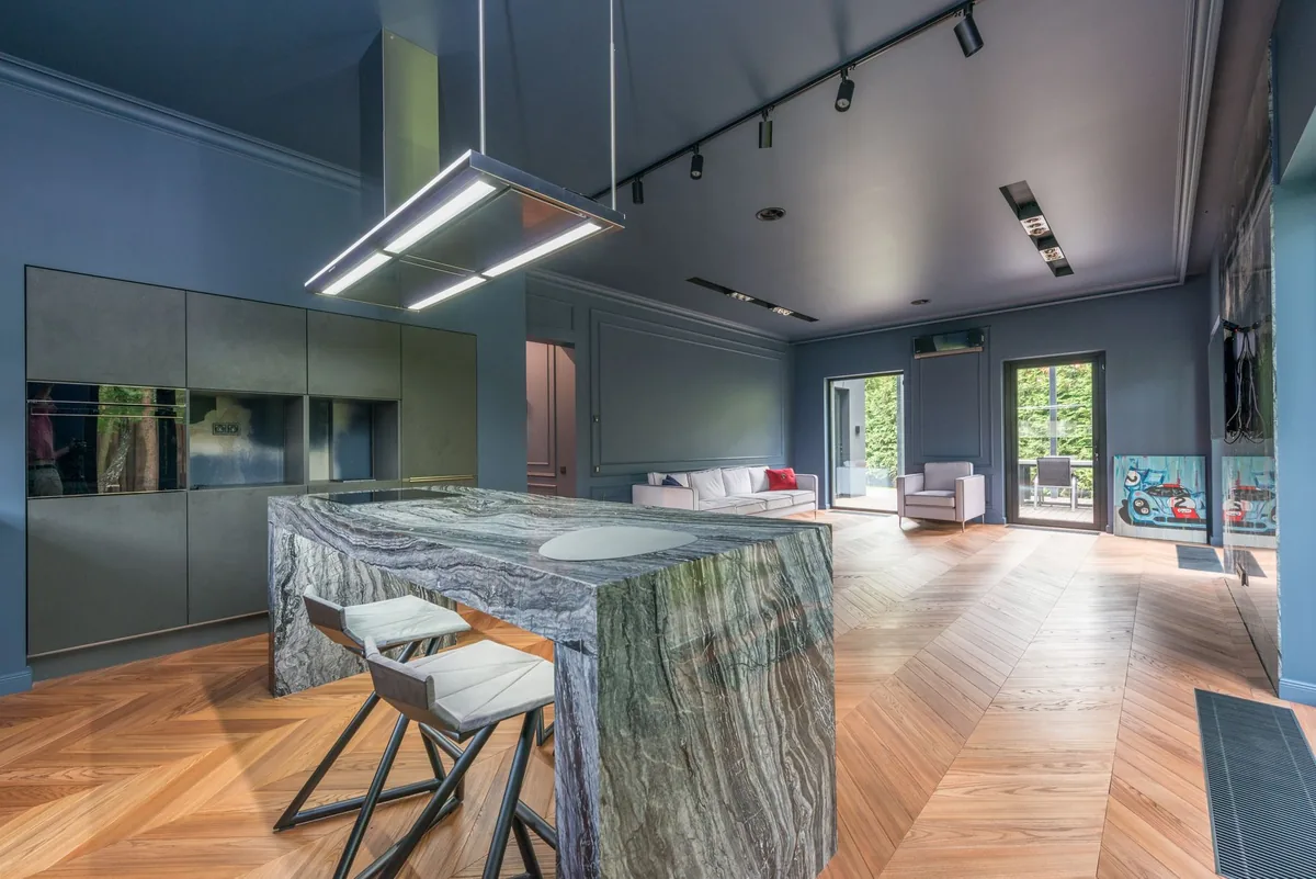 modern open-plan hotel ground floor with kitchen bar and coworking space