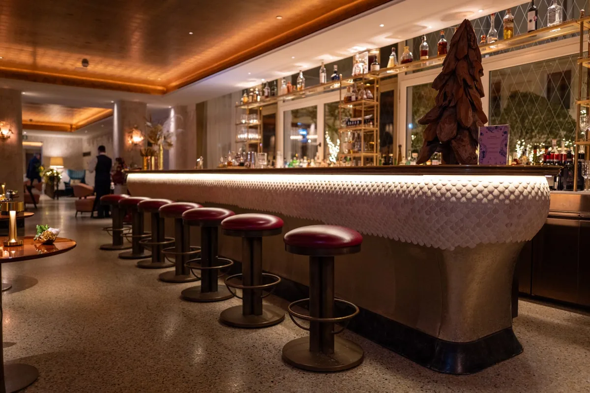 luxury hotel club lounge interior with seating and bar