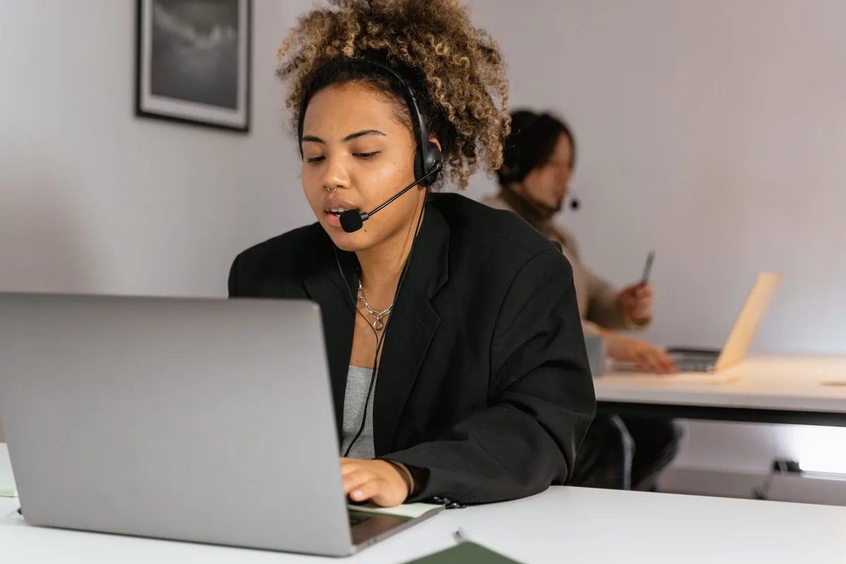travel agent working on laptop office