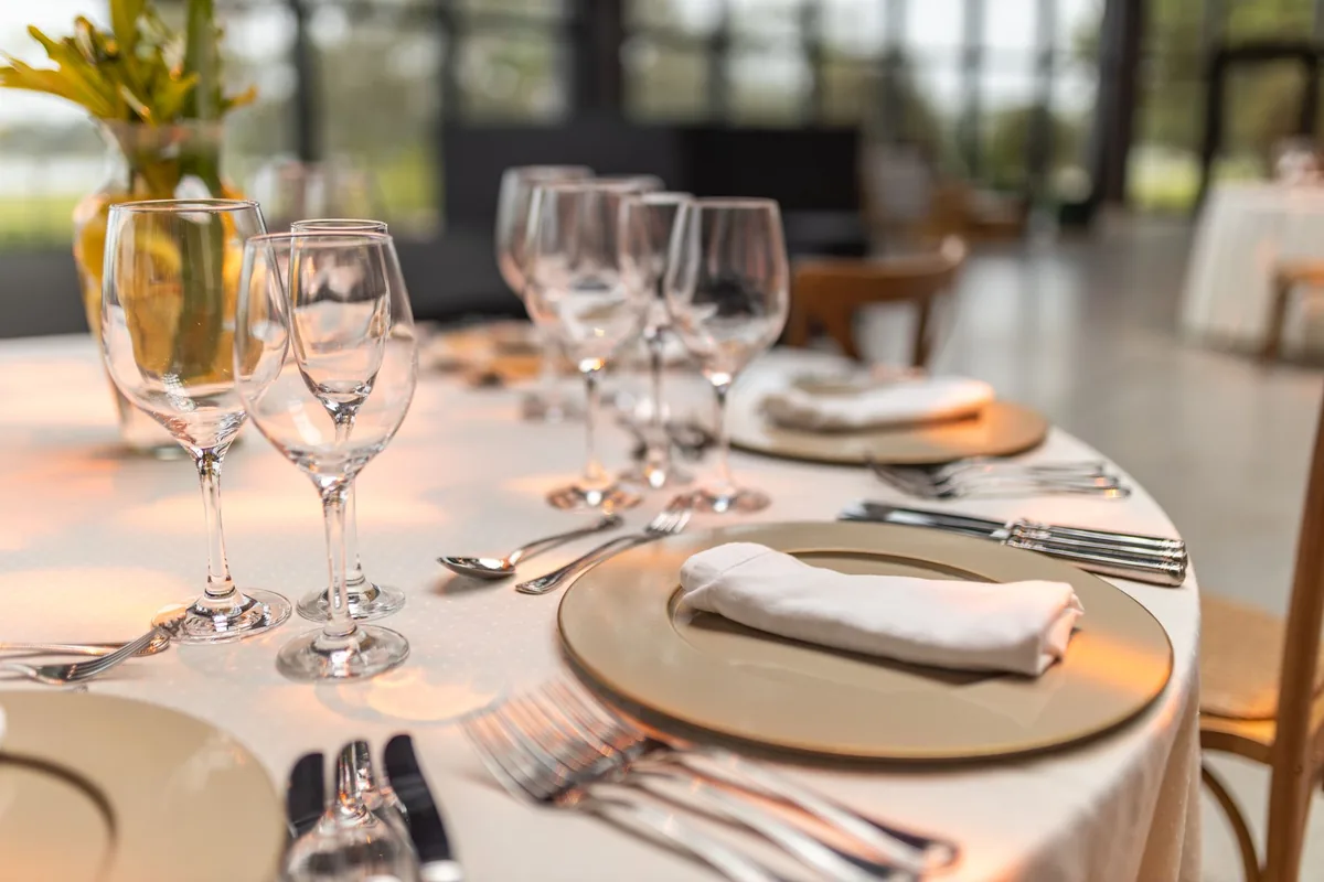 restaurant dining tables set for dinner