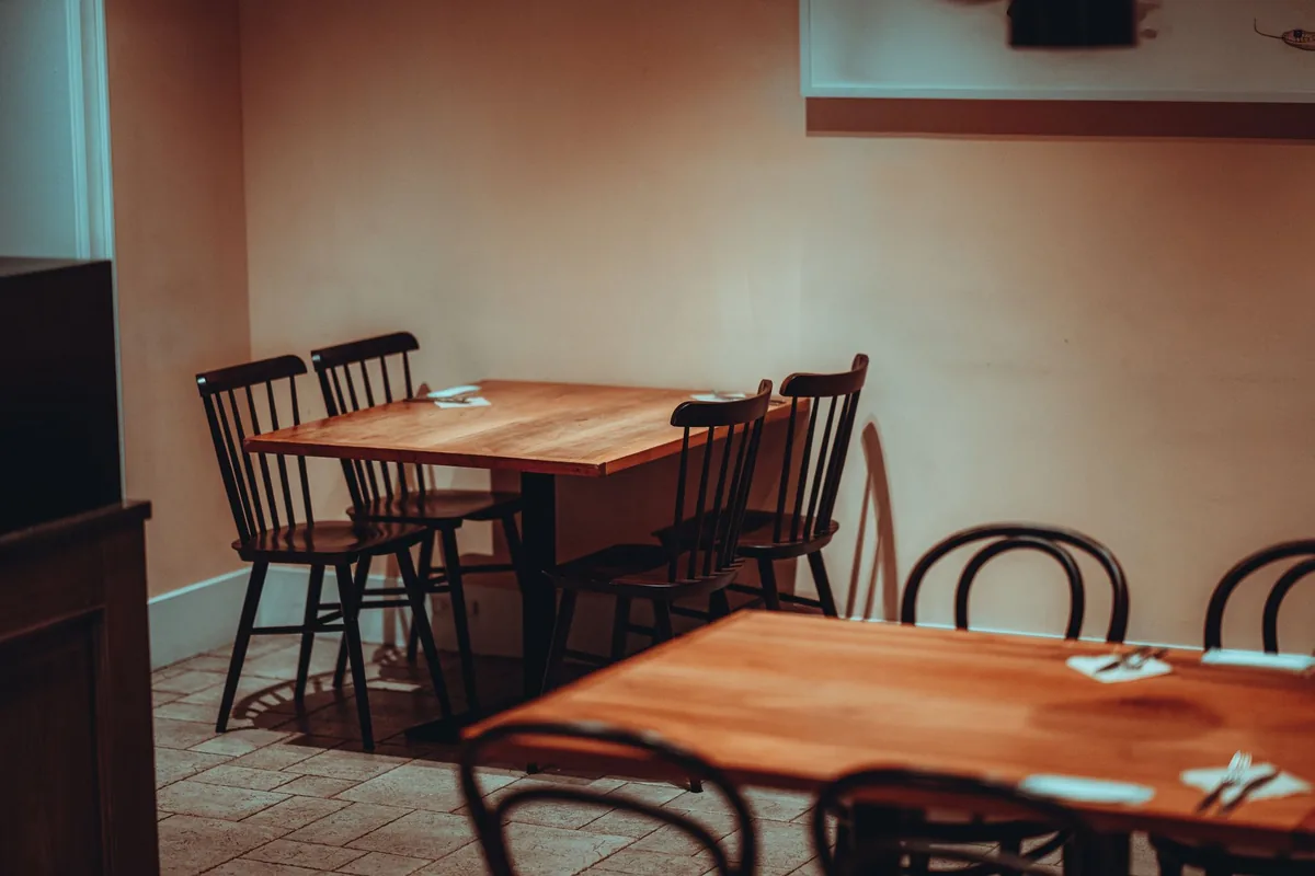 empty restaurant dining room tables