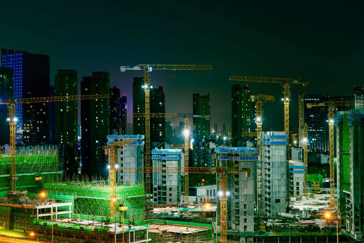 city skyline with high rise construction crane