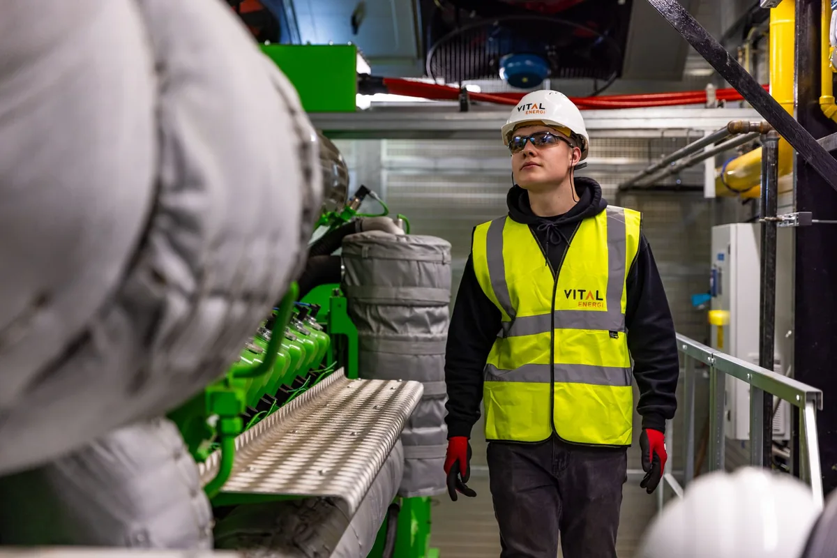 hotel engineer inspecting mechanical room equipment
