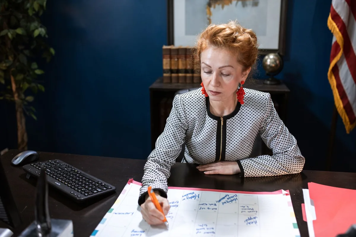 hotel manager reviewing schedules in office