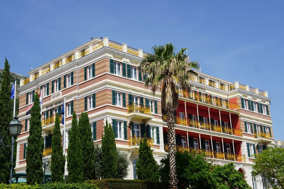 historic boutique hotel exterior palm trees